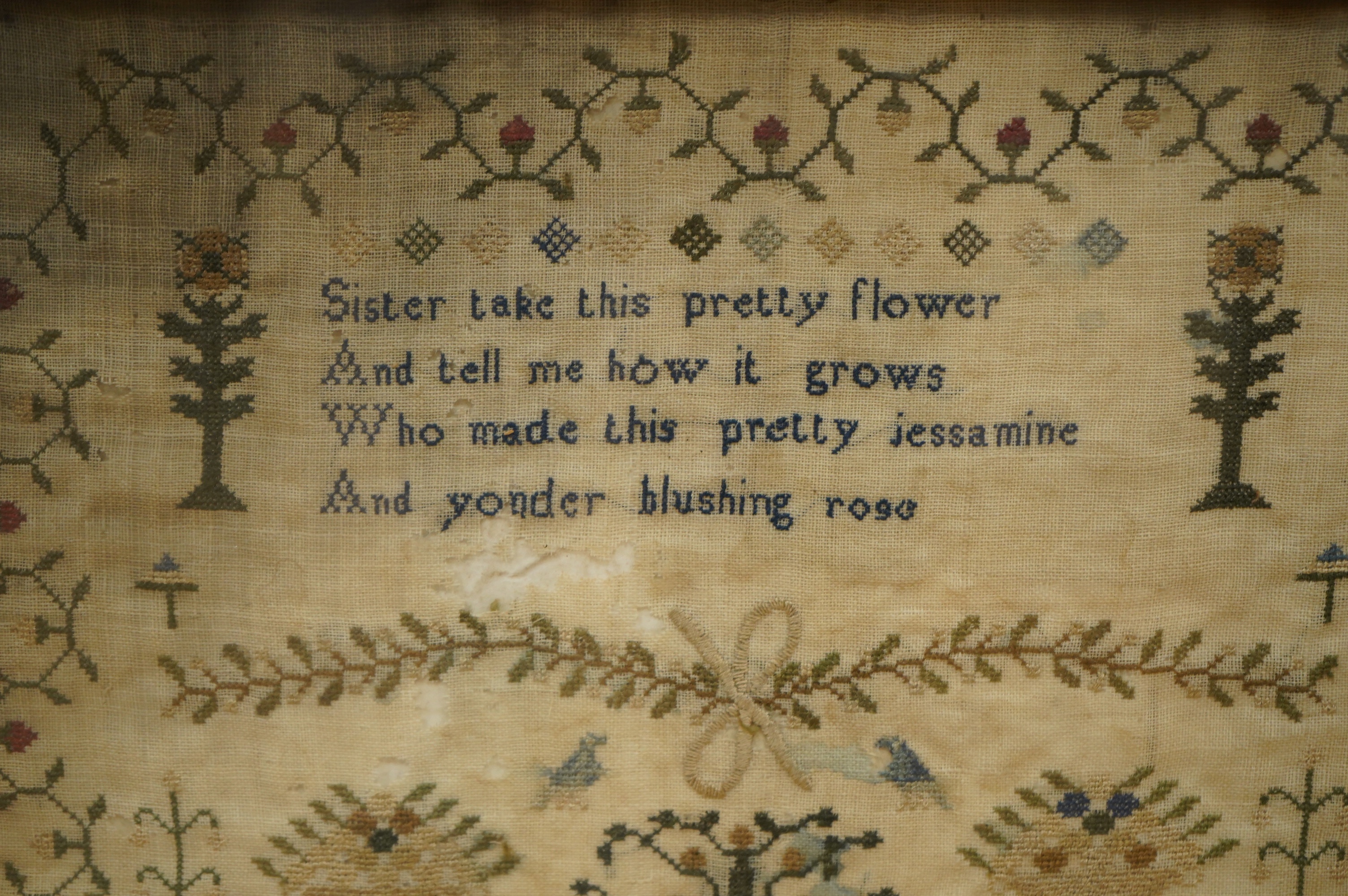 A framed Adam and Eve finely embroidered sampler, by Ann Elenor Molyneu, dated July 1830, Drayton, Oxon, embroidered on fine linen with multi-coloured silks and geometric stylistic floral border, with a short verse above